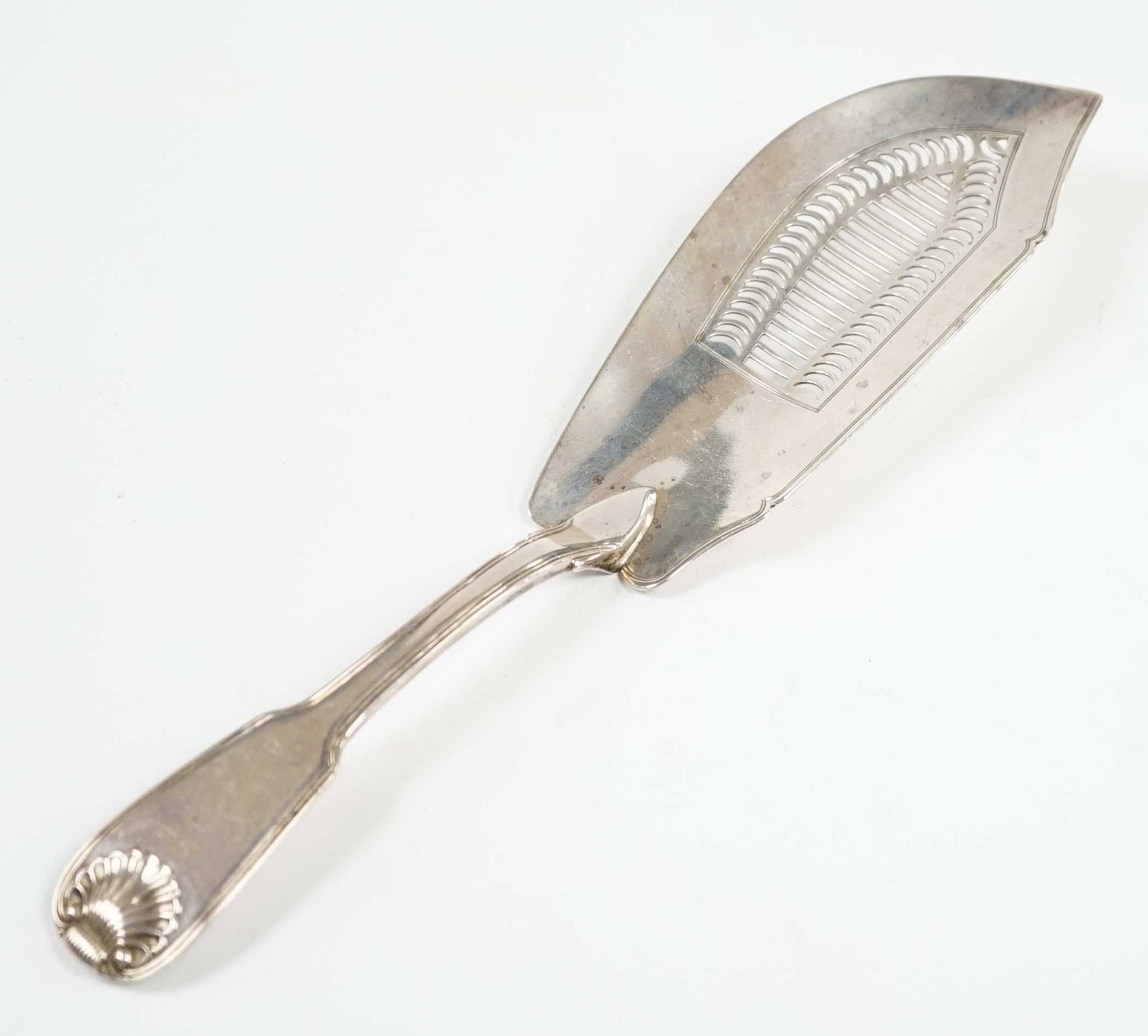 A George III silver fiddle, thread and shell pattern fish slice, Eley, Fearn & Chawner, London, 1810, 31cm, 6oz. Condition - fair